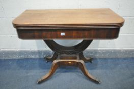 A VICTORIAN MAHOGANY TEA TABLE, with a fold over top, supported by a half circle, four splayed legs,