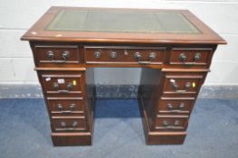 A LATE 20TH CENTURY MAHOGANY PEDASTAL DESK, with green and tooled leather writing surface, and an