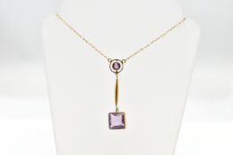A YELLOW METAL AMETHYST DROP PENDANT, WITH TRACE LINK CHAIN, the square cut amethyst collet set,