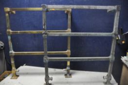 A PAIR OF VINTAGE BRASS WALL MOUNTED HEATED TOWEL RAILS, square design with three rails, along