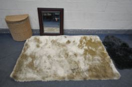 A WHISPER GOLDEN RUG, a small grey rug, a modern wall mirror, and a wicker linen basket (4)
