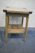 A GOLD PAINTED LLOYD LOOM SQUARE OCCASIONAL TABLE, with a plastic protector, held by brass