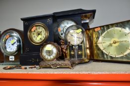 A GROUP OF EIGHT MANTEL CLOCKS, comprising a Kieninger & Obergfell glass domed clock made in West