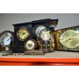 A GROUP OF EIGHT MANTEL CLOCKS, comprising a Kieninger & Obergfell glass domed clock made in West