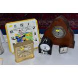 FIVE CLOCKS, comprising a square Art Deco Little Boy Blue wall clock with ceramic dial marked '