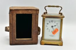 A CARRIAGE CLOCK WITH CASE, a brass carriage clock with glass viewing panels, white dial with Arabic