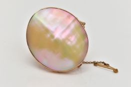 A MID 20TH CENTURY YELLOW METAL MOTHER OF PEARL BROOCH, the mother of pearl panel, within a rub over