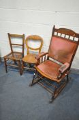 AN EDWARDIAN OAK ROCKING CHAIR, with turned spindles (condition:-in dirty condition) and two other