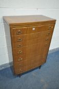 A MID CENTURY AFROMOSIA TEAK CHEST OF SEVEN DRAWERS, on cylindrical legs, width 76cm x depth 44cm