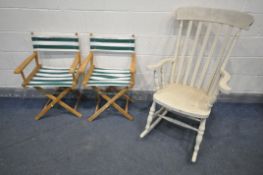 A CREAM PAINTED ROCKING CHAIR, along with a pair of directors chairs, with stripped fabric (