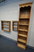 A TALL SLIM OPEN BOOKCASE. with five shelves, width 59cm x depth 32cm x height 244cm, along with two