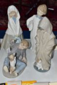 FOUR NAO FIGURES OF CHILDREN, comprising a boy with pillow and alarm clock (glued repair to the