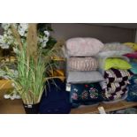 A GROUP OF NEW AND UNUSED CUSHIONS, BOLSTERS, ARTIFICIAL PLANTS AND A LARGE BALE OF NAVY BLUE