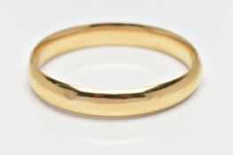 A YELLOW METAL BANGLE, a polished hollow yellow metal oval hinged bangle, fitted with a push pin