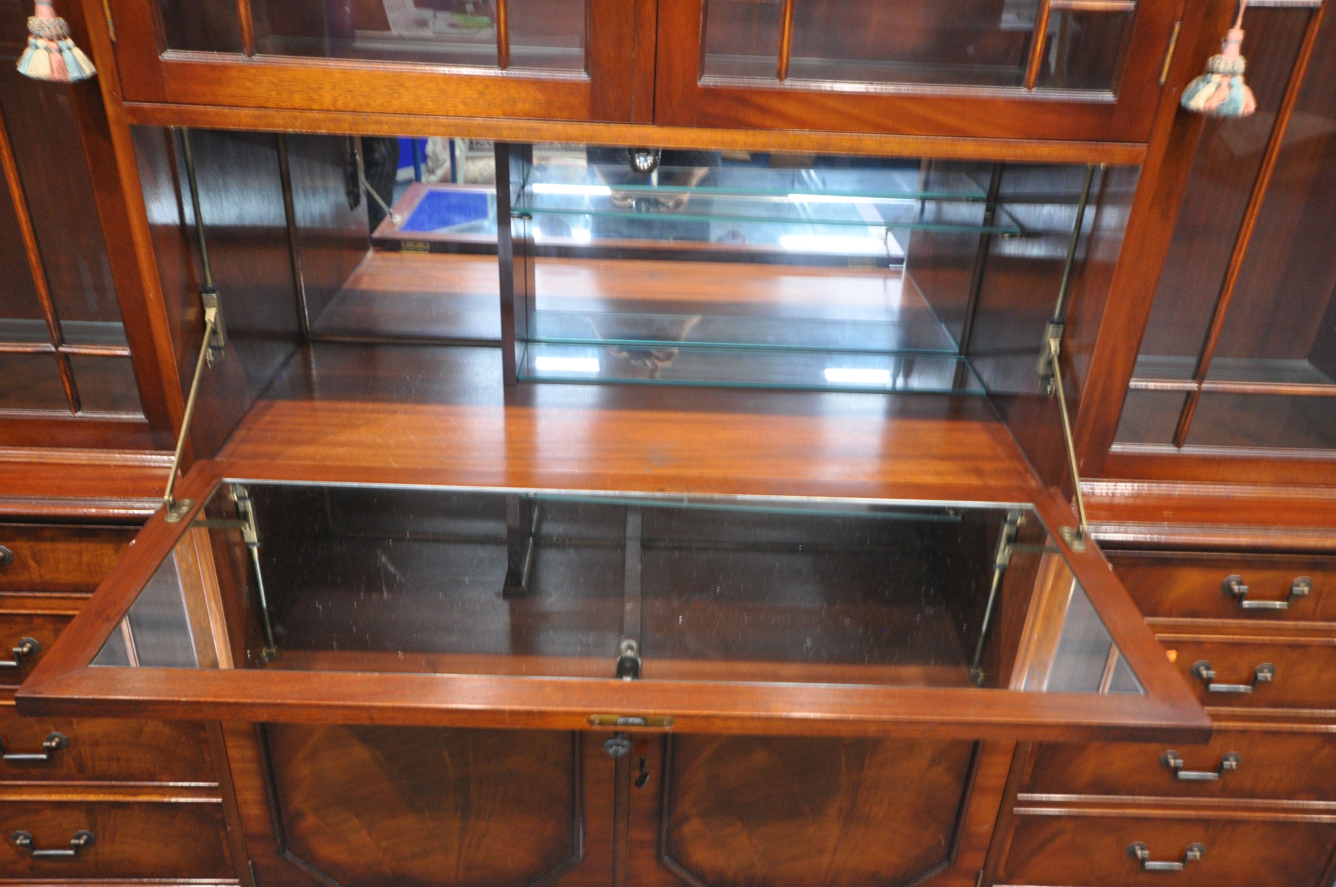 A WADE FURNITURE LTD MAHOGANY BREAKFRONT BOOKCASE, with a central cocktail section, width 207cm x - Image 4 of 4