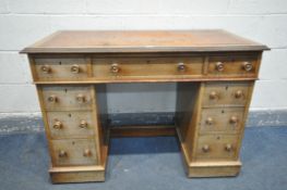 A VICTORIAN MAHOGANY KNEE HOLE DESK, with tan leather inlay, an arrangement of nine drawers, two
