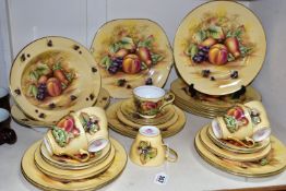 A THIRTY TWO PIECE AYNSLEY 'ORCHARD GOLD' PART DINNER SERVICE, comprising a cake plate, two