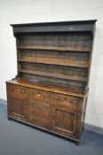 A GEORGIAN OAK DRESSER, the top with a three tier plate rack, over a base with three drawers,