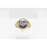 A 9CT GOLD HEMATITE INTAGLIO SIGNET RING, of an oval form depicting a side profile of a soldier