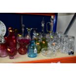 A COLLECTION OF COLOURED AND CLEAR GLASSWARE, including a pair of carafe and glass sets engraved