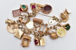 A 9CT YELLOW GOLD CHARM BRACELET, the curb link bracelet, suspending approximately twenty charms, to
