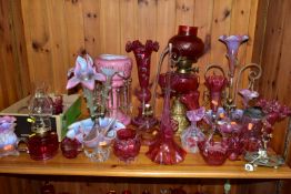 A COLLECTION OF CRANBERRY GLASS, PINK OPALESCENT AND OTHER GLASSWARES, to include an oil lamp with