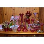 A COLLECTION OF CRANBERRY GLASS, PINK OPALESCENT AND OTHER GLASSWARES, to include an oil lamp with