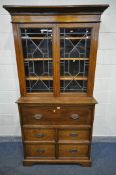 A LATE VICTORIAN OAK SECRETAIRE BOOKCASE, the top with fixed overhanging cornice, double lead glazed