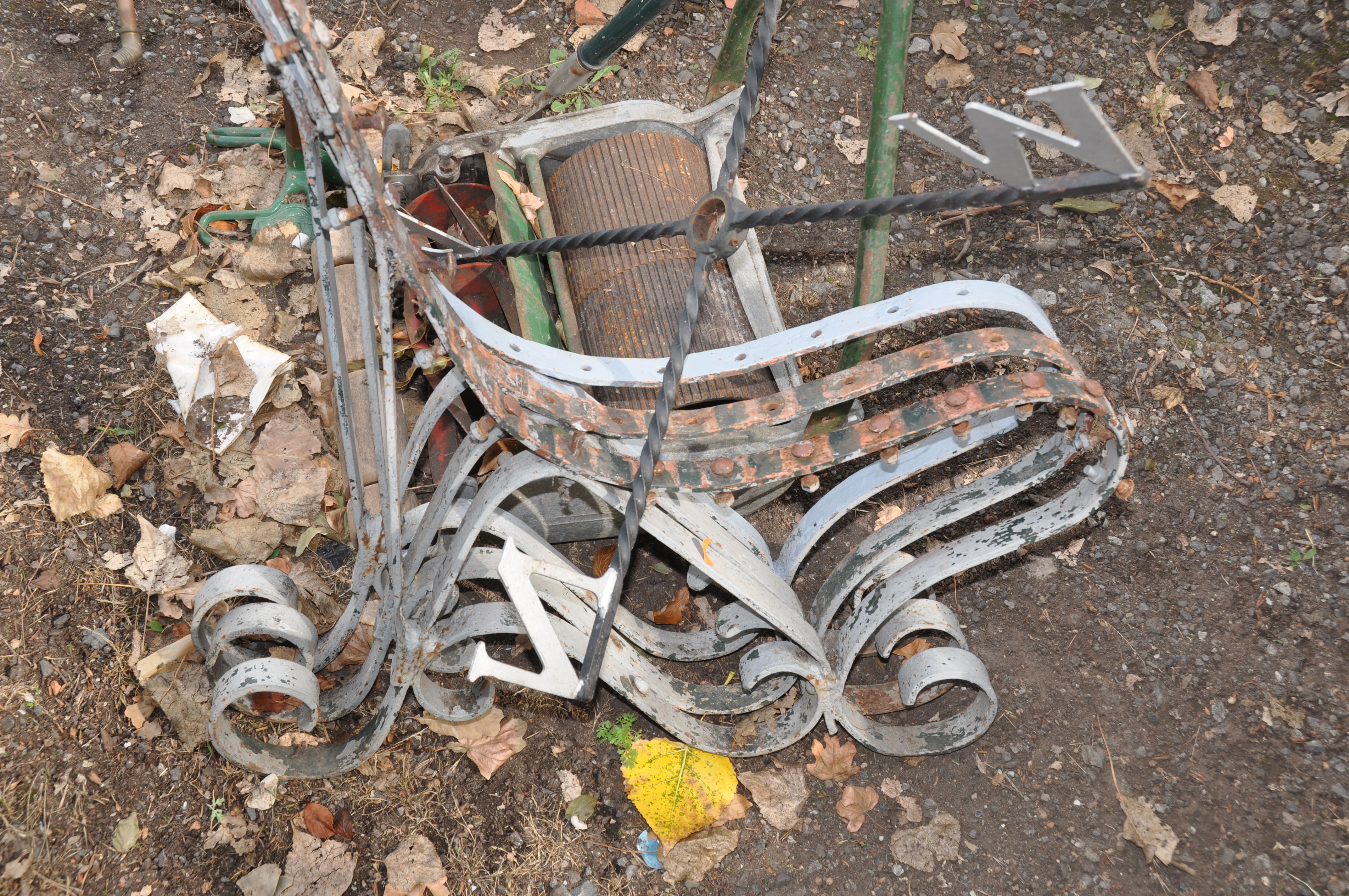 THREE VINTAGE WROUGHT IRON BENCH SUPPORTS with scrolled detailing and curved seat shape, a Dron- - Image 3 of 4