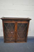 A GEORGIAN MAHOGANY SECRETAIRE BOOKCASE, the top with double astragal glazed doors, enclosing