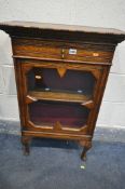 AN EARLY 20TH CENTURY OAK BOOKCASE, fixed overhanging cornice, single drawer above a single glazed