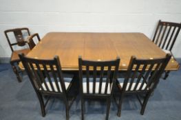A 20TH CENTURY OAK EXTENDING DINING TABLE, with canted corners, one additional leaf on cylindrical
