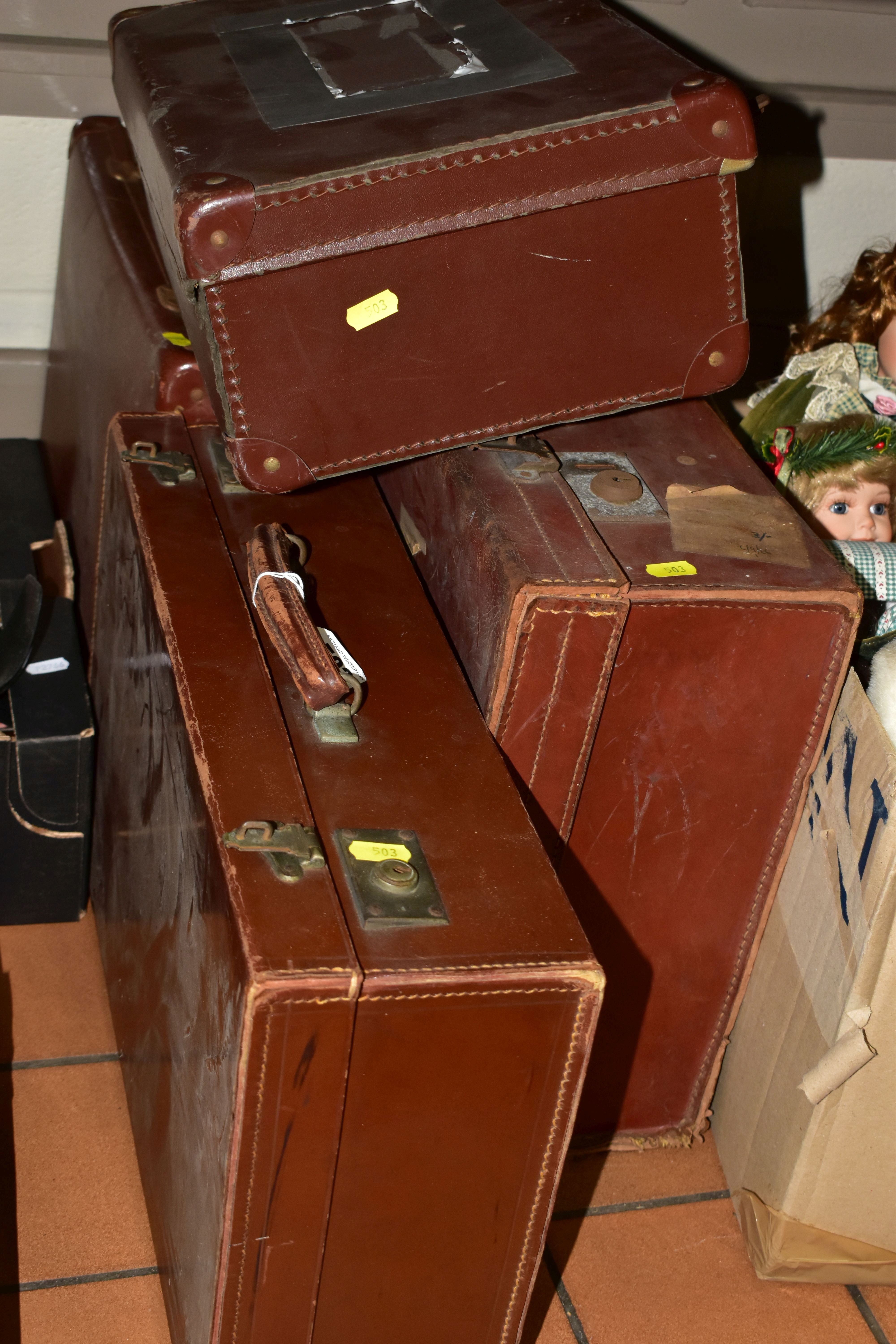 FOUR BROWN 1940S SUITCASES, to include a large suitcase (1966 Railway label), length 64cm x depth