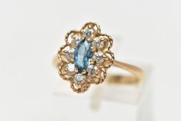 A 9CT GEM SET RING, the ring of a lozenge shape, set with a central marquise cut light blue