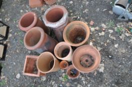 NINE TERRACOTTA PLANT POTS of various shapes, designs and sizes along with three small chimney