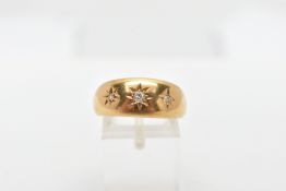 AN 18CT GOLD THREE STONE DIAMOND GYPSY RING, a yellow gold tapered band ring, set with three old cut