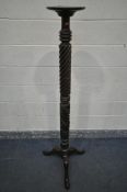 A GEORGIAN STYLE MAHOGANY TORCHERE STAND, on a twisted support, and tripod legs, height 164cm (
