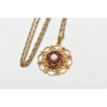 A 9CT GOLD GEM SET PENDANT AND CHAIN, the pendant of an openwork circular form, centring on an eight