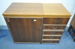 A HORN COLLECTION MID CENTURY TEAK SEWING CABINET, with fold over top, and a mirrored hinged lid,