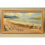 AN EXTENSIVE 20th CENTURY COASTAL LANDSCAPE, OIL ON CANVAS, the stony foreshore leads to calm open