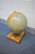 A VINTAGE PHILIPS 13 HALF INCH TERRESTRIAL GLOBE, on a teak base, height 43cm (condition:-some paper