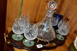 A STUART CRYSTAL SHIPS DECANTER AND SIX BOXED BRANDY GLASSES, in Shaftesbury pattern, on a wooden