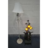 AN ART DE FRANCE RESIN FIGURAL LAMP, the three branches with orange glass shades, depicting two