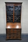 A GEORGIAN MAHOGANY, CROSSBANDED AND INLAID BUREAU/BOOKCASE, with the top section with double