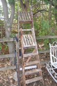 TWO VINTAGE WOODEN STEP LADDERS the tallest being 197cm high