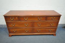 A YEWWOOD SIDEBOARD/CHEST OF SEVEN ASSORTED DRAWERS, width 152cm x depth 48cm x height 74cm (