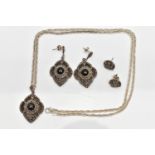 A WHITE METAL ONYX SET PENDANT NECKLACE AND EARRING SET, the pendant of an openwork diamond shape,