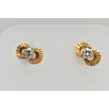 A PAIR OF DIAMOND EARRINGS, a pair of yellow metal stud earrings, each earring prong set with a