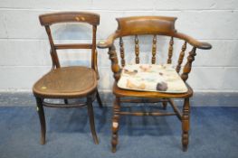 AN EARLY 20TH CENTURY ELM AND BEECH BOW BACK SMOKERS ARMCHAIR, with a loose seat cushion, along with