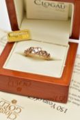 A 18CT GOLD 'CLOGAU' THREE STONE DIAMOND RING, a limited edition Welsh gold tree of life ring,